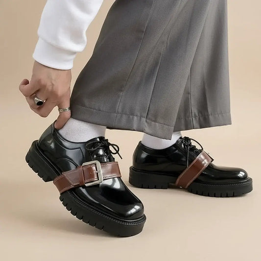 Cross Buckle Leather Tabbi Loafers worn with grey trousers, showing stylish details and unique buckle design.
